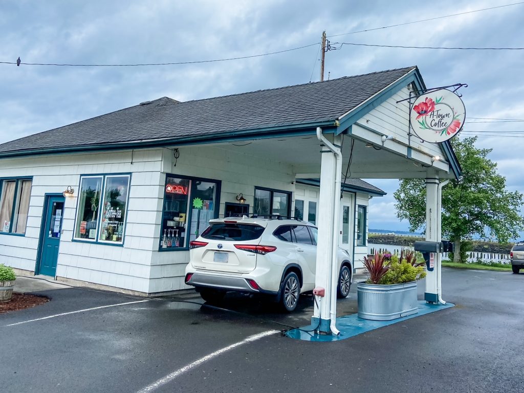 A-Town Coffee, a white building with a drive through window serving coffee.