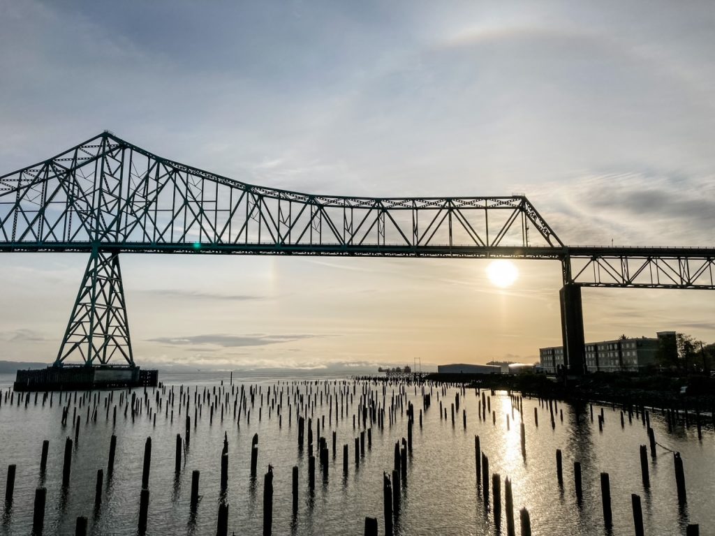 View of the Astoria-Megler Bridge just after sunrise, one of the free things to do in Astoria, Oregon.