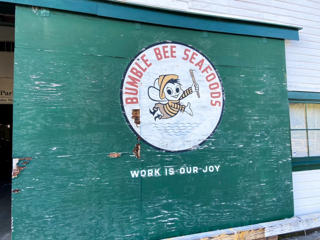 Vintage Bumble Bee Seafoods logo against an aqua background, marking the entrance to the Hanthorn Cannery Museum.